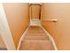 Carpeted staircase creating a warm and inviting transition between floors at 4161 Windermere Dr, Lithonia, GA 30038