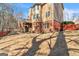 Backyard of home with deck and mature trees at 1654 Summersweet Ln, Dacula, GA 30019