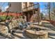 Backyard patio area with fire pit and retaining wall at 1654 Summersweet Ln, Dacula, GA 30019