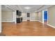Finished basement with wet bar, hardwood floors, and neutral paint at 1654 Summersweet Ln, Dacula, GA 30019