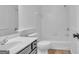 Bathroom has white cabinets, a tub-shower combination and tile floors at 1654 Summersweet Ln, Dacula, GA 30019