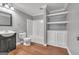 Bathroom featuring wood-look floors, new fixtures, and built in storage at 1654 Summersweet Ln, Dacula, GA 30019