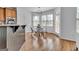 Breakfast nook with bright windows, hardwood floors and a door to the deck at 1654 Summersweet Ln, Dacula, GA 30019