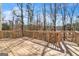 Wooden deck with railings overlooking the backyard at 1654 Summersweet Ln, Dacula, GA 30019