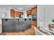 Open kitchen with breakfast bar seating and modern appliances at 1654 Summersweet Ln, Dacula, GA 30019