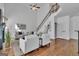 Bright living room with a high ceiling, fireplace, and modern decor with lots of natural light at 1654 Summersweet Ln, Dacula, GA 30019