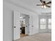 Spacious bedroom featuring trey ceiling, neutral carpet and doorway to main bathroom at 1654 Summersweet Ln, Dacula, GA 30019