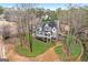 Stunning aerial view of a two-story home showcasing a welcoming front porch and well-manicured landscaping at 600 Lake Overlook Dr, Canton, GA 30114