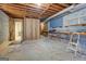 Unfinished basement featuring concrete floors, cinder block walls, exposed ceiling and workbench area at 825 Sugar Creek Se Way, Conyers, GA 30094