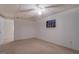 Basement with carpet flooring, white walls, a small window, and a drop ceiling with a light at 825 Sugar Creek Se Way, Conyers, GA 30094