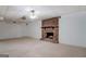 Basement area with carpet flooring, white walls, and a brick fireplace with a wooden mantel at 825 Sugar Creek Se Way, Conyers, GA 30094