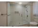 Bathroom with glass shower doors and decorative tile at 825 Sugar Creek Se Way, Conyers, GA 30094