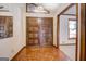 Inviting foyer with hardwood floors and double front doors at 825 Sugar Creek Se Way, Conyers, GA 30094