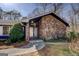 Inviting front entrance with stone accents and modern double doors at 825 Sugar Creek Se Way, Conyers, GA 30094