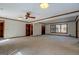 Comfortable living room with neutral carpet, wood trim, ceiling fan and natural light creating a cozy atmosphere at 825 Sugar Creek Se Way, Conyers, GA 30094