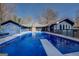 View of the pool with a clear blue sky above the home's exterior at 825 Sugar Creek Se Way, Conyers, GA 30094