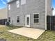 Backyard patio with gray siding, offering a serene and relaxing outdoor space at 789 Galveston Way, Mcdonough, GA 30253