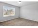 Bedroom with window and neutral paint and carpet at 789 Galveston Way, Mcdonough, GA 30253