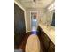 Bathroom with wood floors, vanity, and an adjoining room with a toilet at 848 Still Rd, Lawrenceville, GA 30045