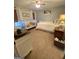 Bedroom with a crib, bed, white furniture, neutral walls, and a ceiling fan at 848 Still Rd, Lawrenceville, GA 30045