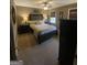 Bedroom with a large bed, bedside lamps, and dark brown walls at 848 Still Rd, Lawrenceville, GA 30045