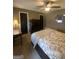 Bedroom with a large bed, dark wood furniture, and neutral walls at 848 Still Rd, Lawrenceville, GA 30045