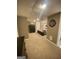 A peek into the bedroom with neutral colored walls, carpet, a bed, and large dresser at 848 Still Rd, Lawrenceville, GA 30045