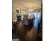Dining room with hardwood floors, a chandelier, large windows, and a rustic dining table at 848 Still Rd, Lawrenceville, GA 30045