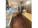 Kitchen featuring dark cabinetry, granite counters, an island, and a breakfast nook area with wicker chairs at 848 Still Rd, Lawrenceville, GA 30045