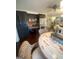 Kitchen and dining area with black cabinetry, stainless steel appliances, granite counters, and stylish decor at 848 Still Rd, Lawrenceville, GA 30045
