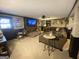 Living room featuring a brick fireplace, a large TV, and a comfortable sectional sofa at 848 Still Rd, Lawrenceville, GA 30045