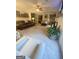 Spacious living room featuring plush carpet, comfortable seating, and a ceiling fan for added comfort at 848 Still Rd, Lawrenceville, GA 30045