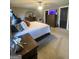 Well-lit main bedroom with a large bed, dark furniture and carpeted floors for comfort at 848 Still Rd, Lawrenceville, GA 30045