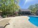 Landscaped backyard featuring a swimming pool and a patio at 848 Still Rd, Lawrenceville, GA 30045