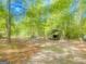 Tree-lined property featuring several covered RV parking spots at 848 Still Rd, Lawrenceville, GA 30045