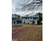 An expansive backyard featuring a storage shed with a shed, ideal for outdoor activities at 5865 Vernier Dr, Atlanta, GA 30349
