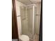 Bathroom with a shower stall featuring glass doors and chrome fixtures at 5865 Vernier Dr, Atlanta, GA 30349