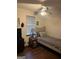 Comfortable bedroom featuring a single bed, wooden nightstand, and ceiling fan at 5865 Vernier Dr, Atlanta, GA 30349