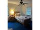 Cozy bedroom featuring a single bed, wooden nightstand and two large windows at 5865 Vernier Dr, Atlanta, GA 30349