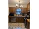 Kitchen featuring stainless steel appliances, vintage tile, and wood cabinets at 5865 Vernier Dr, Atlanta, GA 30349