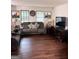 Cozy living room with two gray sofas and a dark wood entertainment center at 5865 Vernier Dr, Atlanta, GA 30349