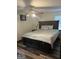 Bedroom featuring a large bed with wood flooring and a ceiling fan at 5865 Vernier Dr, Atlanta, GA 30349