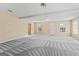 Spacious living room featuring lots of natural light and neutral walls at 11789 Registry Blvd, Hampton, GA 30228