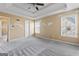 Spacious main bedroom with a tray ceiling and lots of natural light at 11789 Registry Blvd, Hampton, GA 30228