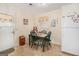 Eat-in kitchen with wood table and chairs, natural light from one window, and linoleum flooring at 143 Teamon Rd, Hampton, GA 30228