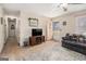 Living room with a large patterned rug and ceiling fan at 143 Teamon Rd, Hampton, GA 30228