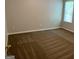 Bedroom featuring neutral carpet and window with blinds at 165 Lakeside Pt, Covington, GA 30016