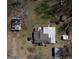 Aerial shot of house surrounded by multiple sheds and tin roofed buildings at 123 Cowan Rd, Covington, GA 30016