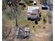 Aerial image of the house, multiple outbuildings, and adjacent street at 123 Cowan Rd, Covington, GA 30016