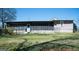 Backyard view features a spacious screened porch and partial fence at 123 Cowan Rd, Covington, GA 30016